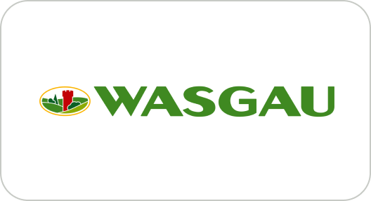 WASGAU Logo mit grünem Schriftzug und Emblem einer roten Burg vor grünen Hügel